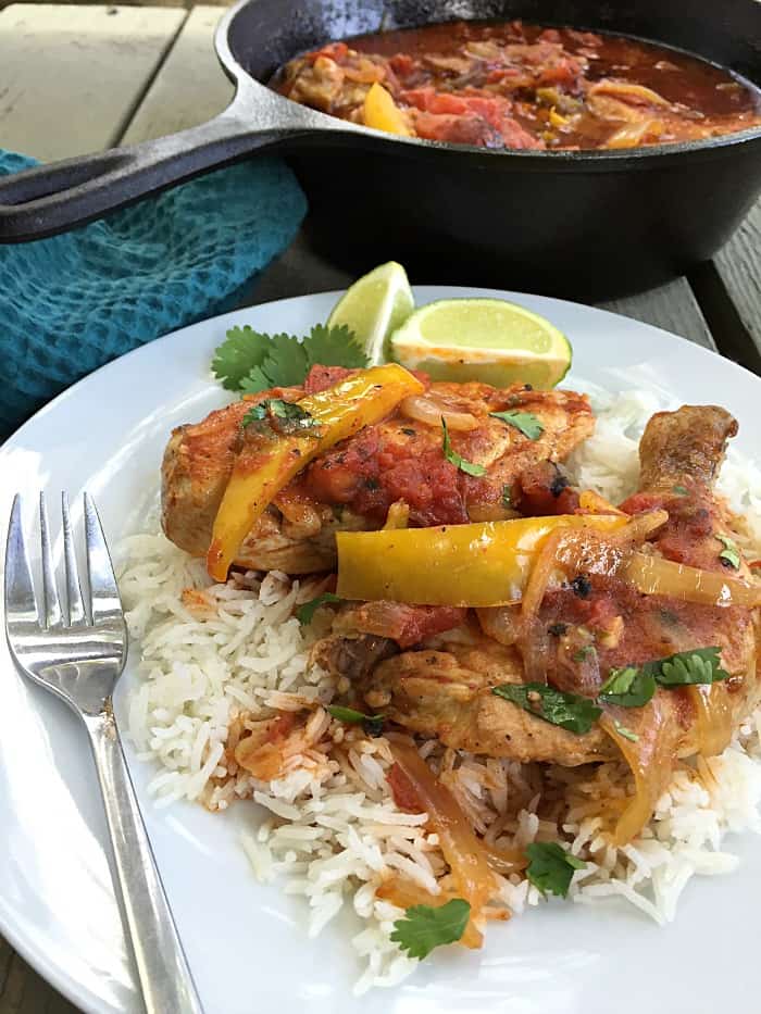 This flavorful BRAISED CHICKEN WITH TOMATOES AND PEPPERS recipe is comfort food at it's finest and a hearty meal that your whole family will love.