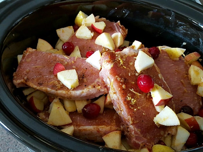 Crock-Pot Cran-Apple Pear Pork Chops - Here’s a new way to bring some flavor to those pork chops! The perfect mixture of sweet, tart and spice!