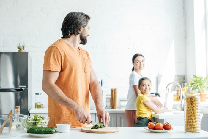 parents and child in the kitchen